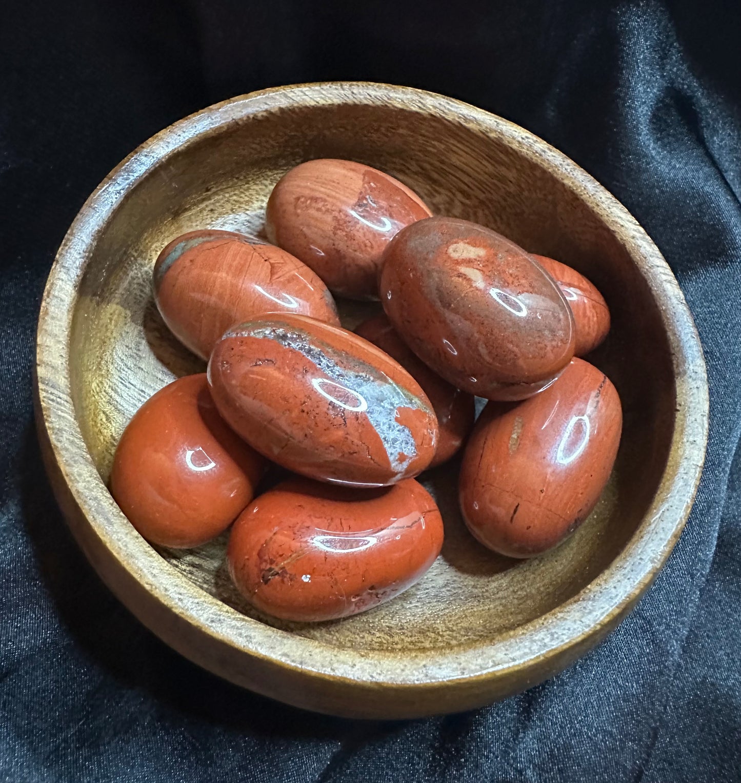 Red Jasper tumbled stone, opaque brick-red, lightly mottled