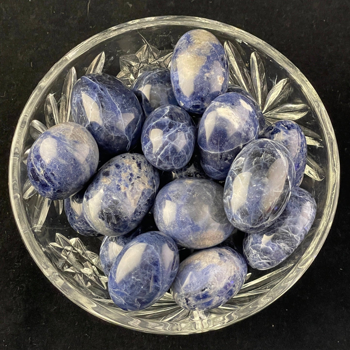 Sodalite tumbled stone, deep royal blue marbled with white