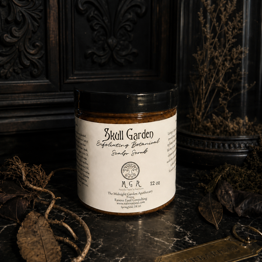 A jar of Skoll Garden Exfoliating Botanical Suede Scrub sits on a dark marble surface surrounded by dried botanical elements, with a dark carved wooden background and a glass dome containing dried flowers behind it.