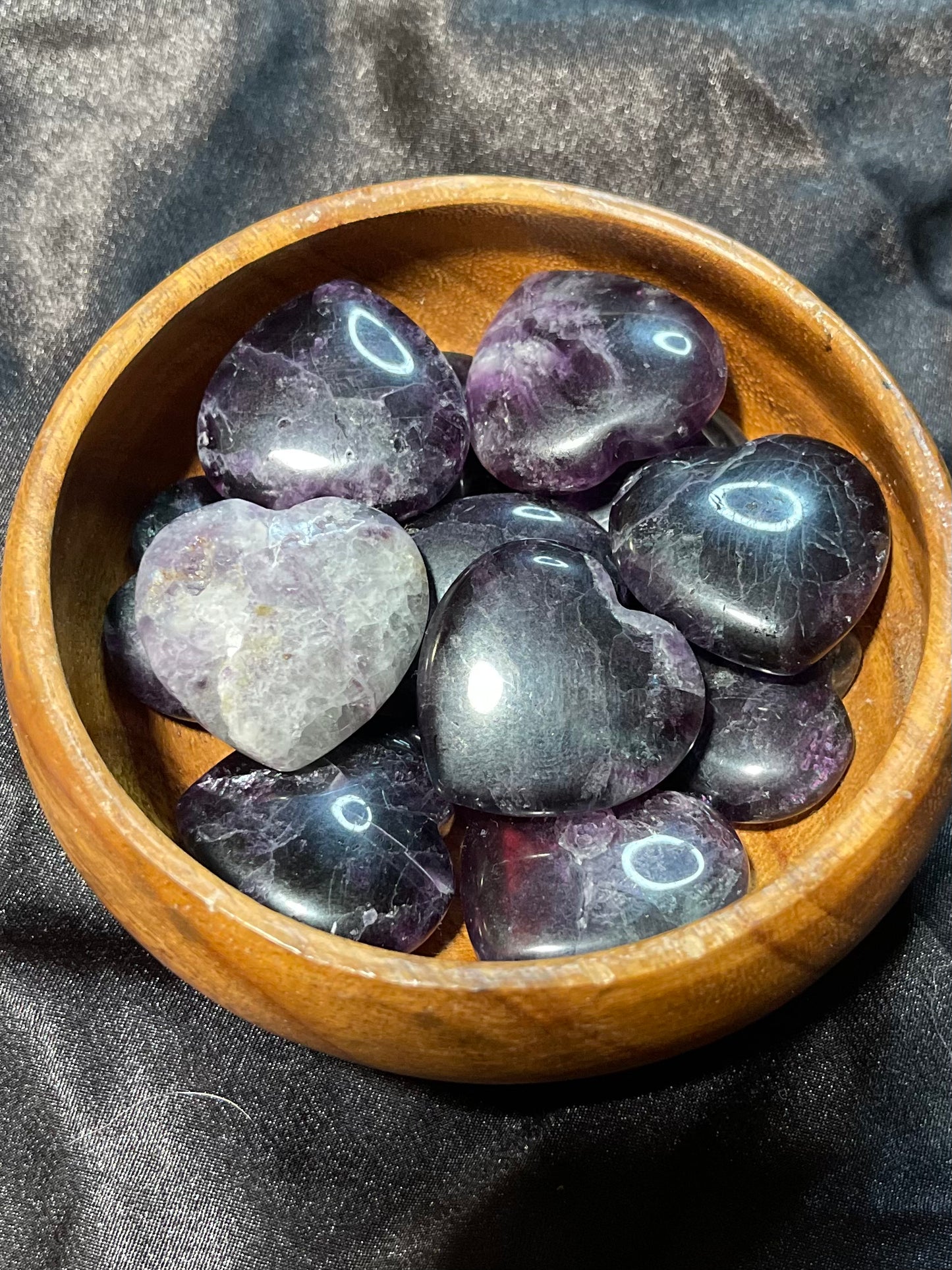 Purple/Rainbow Fluorite crystal heart, turned to catch the light