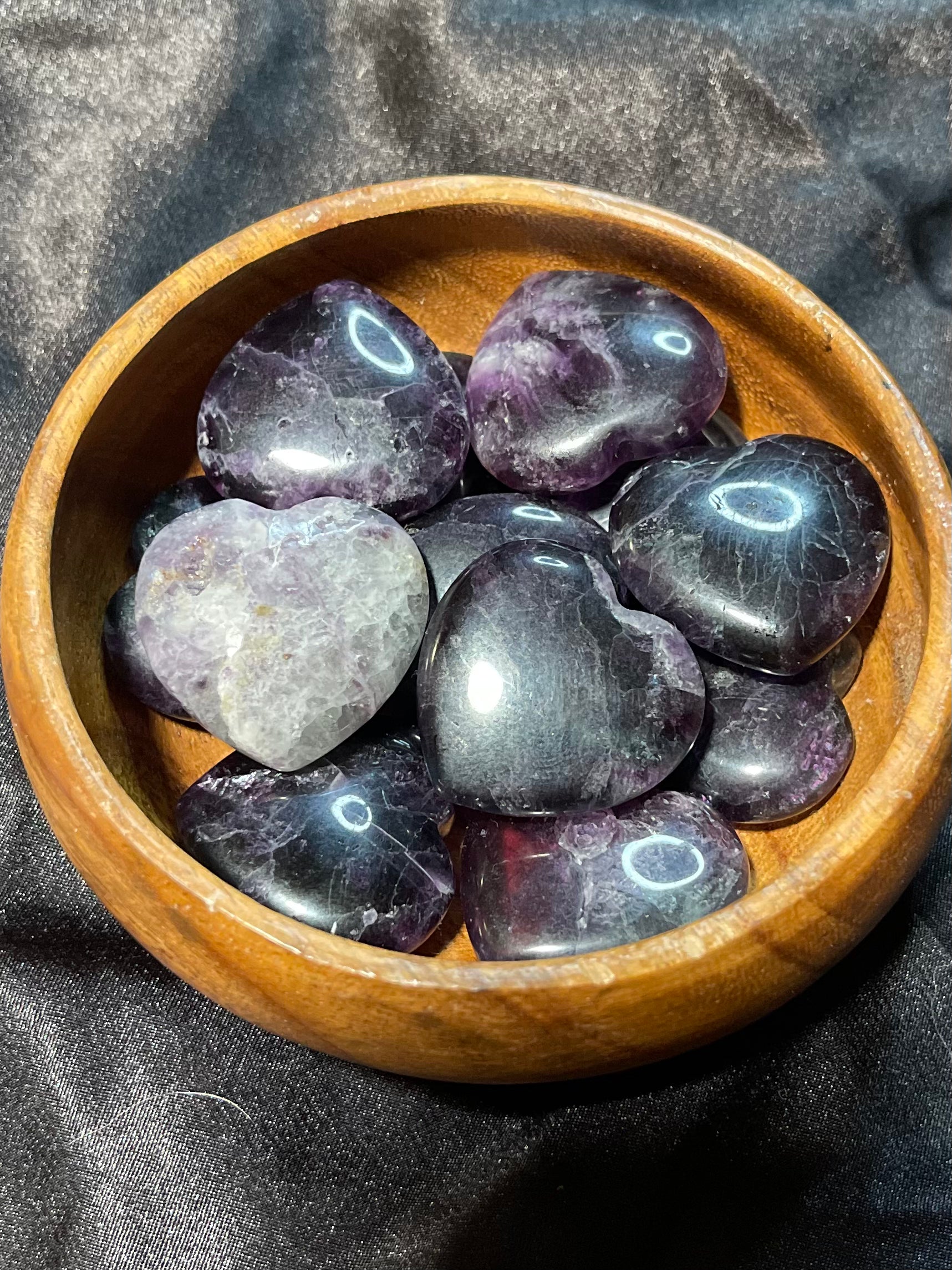 Purple/Rainbow Fluorite crystal heart, turned to catch the light